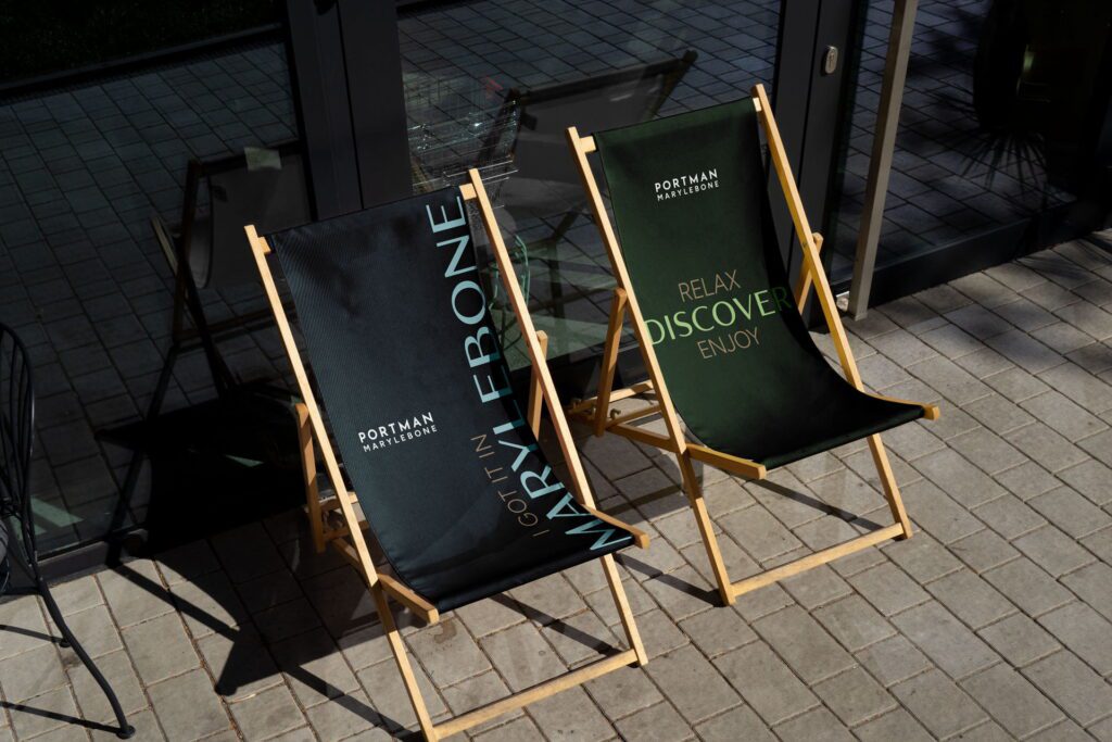 Portman Marylebone branded deck chairs with ‘Relax, Discover, Enjoy’ outdoor seating design