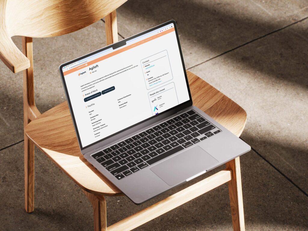 LawTech UK company profile for Agiloft on a laptop screen, displaying detailed brand information, areas of work, and contact details for legal contract management software.