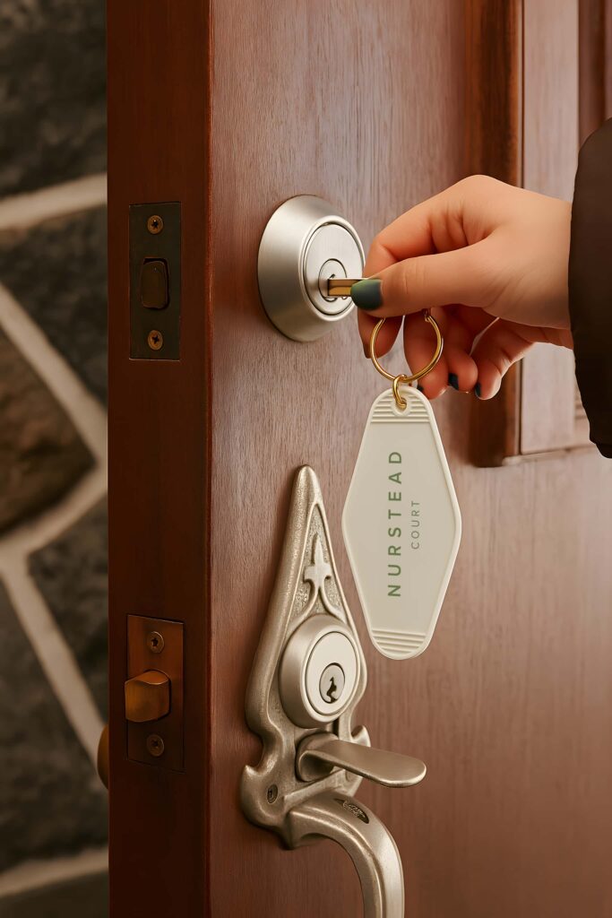 Nurstead Court branded key holder showcasing luxury hospitality brand identity and thoughtful guest experience design for a premium venue