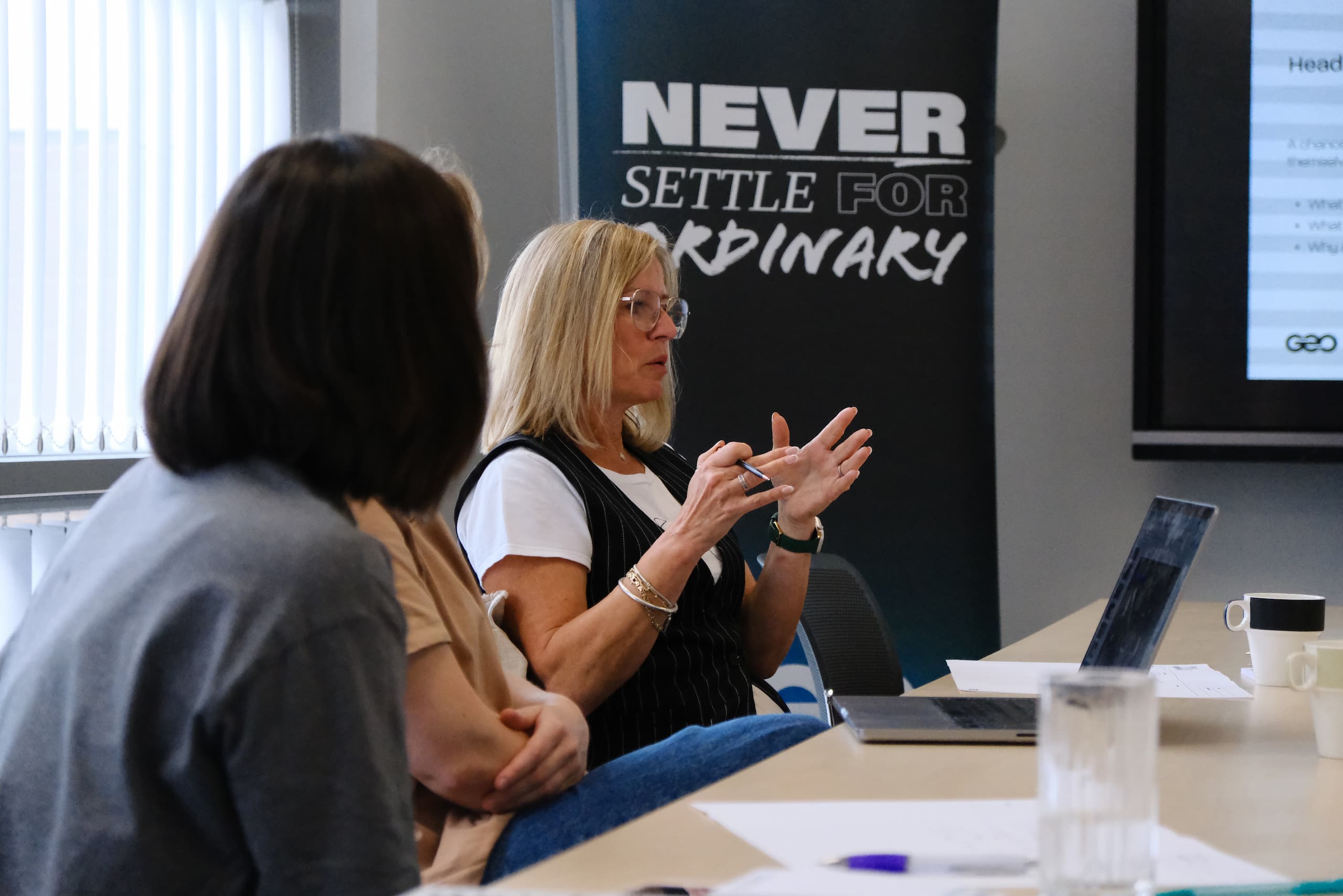 Business Collaboration in Brand Strategy Workshop Two participants discussing ideas during brand strategy and positioning workshop