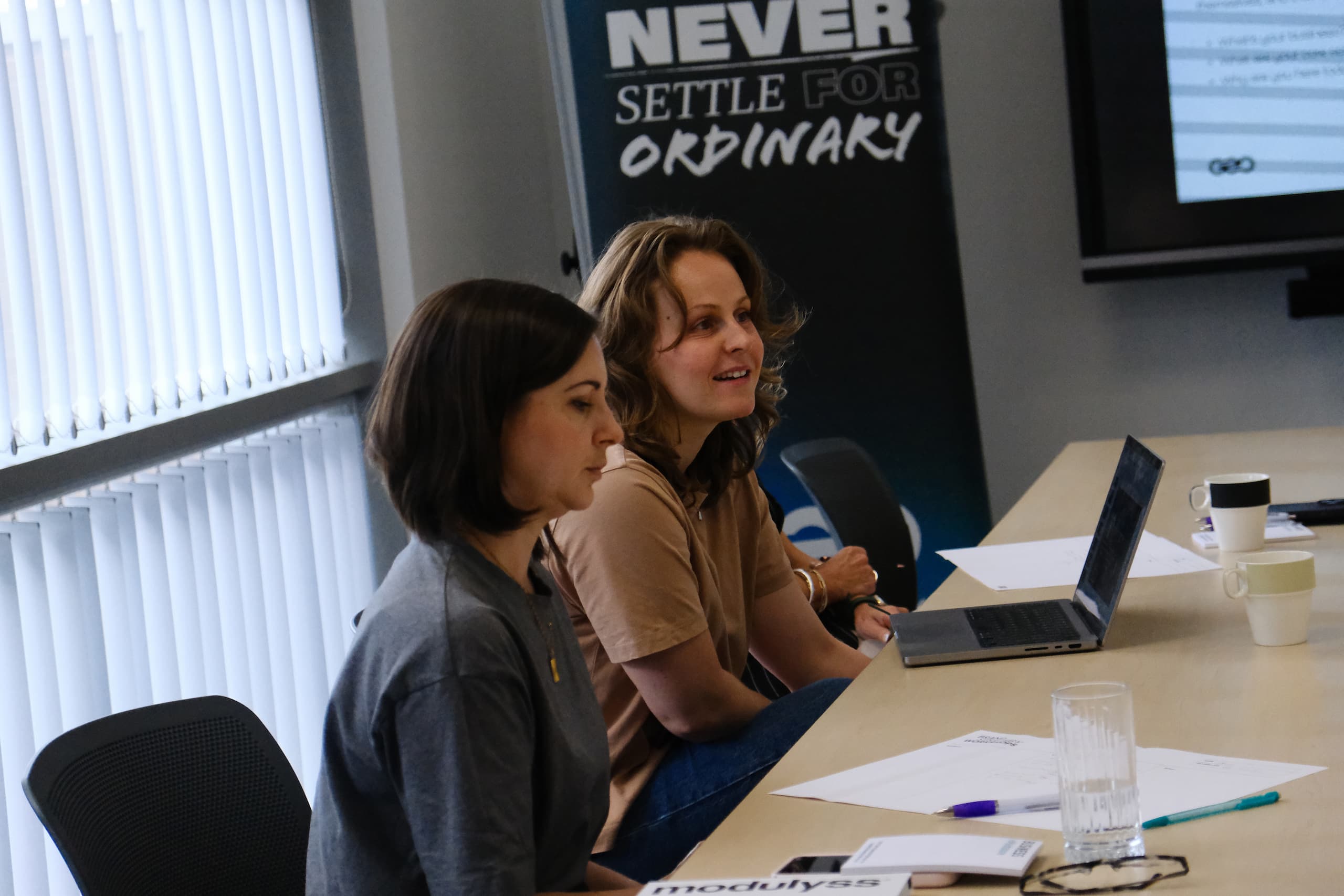 Designer collaborating with attendee during brand strategy and positioning workshop